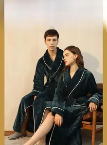 Detail of dark green flannel robe with white piping and thick warmth-retaining texture