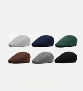 Detail view of cotton flat caps in six colors: grey, navy, green, coffee, and black