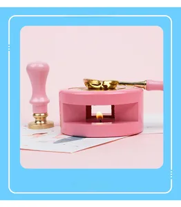 Roze lakstempel verwarmer met gouden smeltlepel en bijpassend handvat voor DIY projecten