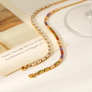Detailed shot of 18K gold plated chain bracelets with clear and colorful zircon stones
