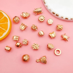 Detailed assortment of KC gold alloy large hole beads in turtle crown and butterfly shapes