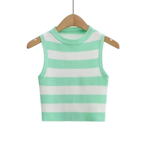 Detail of mint green and white striped knit crop top hanging on a wooden hanger