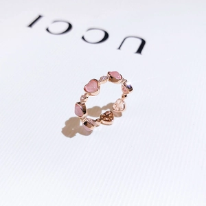 Rose gold adjustable ring featuring pink cat-eye heart stones and sparkling micro-diamonds