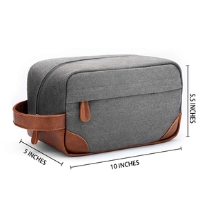 Detailed dimension view of grey canvas toiletry bag with brown leather accents.