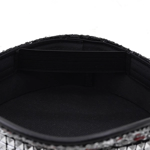Detail of black party hat interior showing sequin trim and adjustable elastic strap