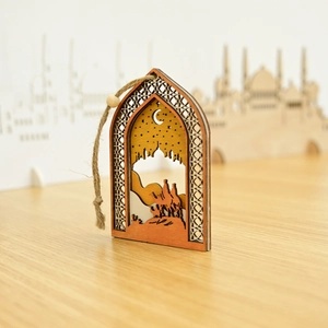Detailed view of hollow wooden festive pendant with desert camel and mosque silhouette