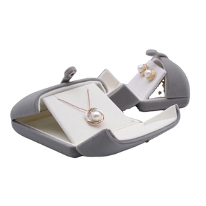 Grey velvet jewelry boxes for necklaces and earrings shown from a 45-degree angle