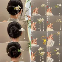 Detailed set of golden hair sticks with lily of the valley flowers and pearl tassels