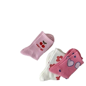 Pink and white cotton mid-calf socks with cherry, flower, and heart patterns for girls