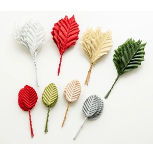 Detailed view of colorful artificial Christmas leaves for DIY crafts with wire stems