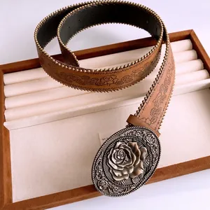 Vintage leather waist chain with rose embossed oval buckle and metal rivet edge detailing