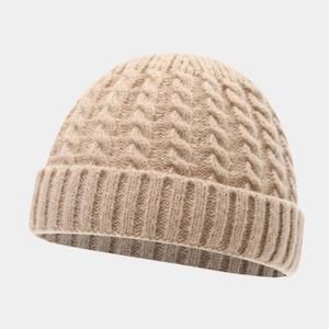 Detailed view of beige cable knit beanie with thick ribbed cuff for winter warmth