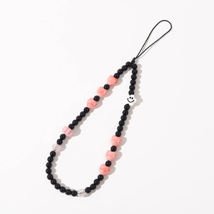 Dragonne de téléphone en perles noires, cœurs roses et breloque fleur sourire design