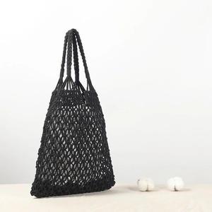 Handmade black macramé woven tote bag with cotton rope and geometric mesh patterns