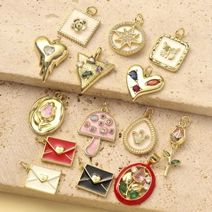 Chic gold-plated enamel pendants featuring heart, mushroom, and floral designs on stone