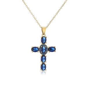 Detail of 18K gold-plated cross pendant featuring oval dark blue sapphires and zircon
