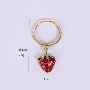 Detail shot of a red 3D strawberry keychain with dimensions 5.8cm height and 2cm width
