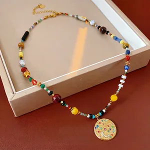 Bohemian multicolored beaded necklace with a gold coin pendant featuring zircon inlays