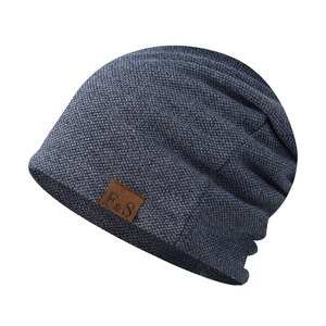 Navy blue waffle knit beanie with leather logo patch for men and women outdoor wear