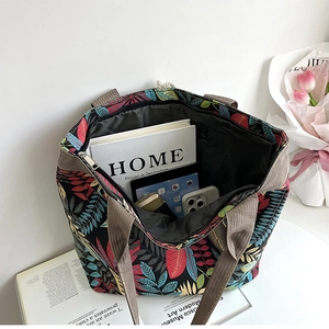 Top-down view of spacious canvas tote bag interior showing large capacity and leafy pattern