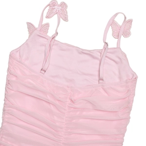 Detail of pink pleated camisole featuring delicate butterfly embroidery on mesh fabric