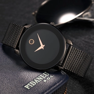 Minimalist black mesh strap watch with rose gold dial accent on leather background