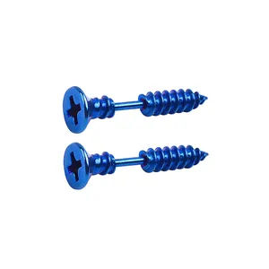 Macro detail of blue stainless steel screw earrings with creative threaded design