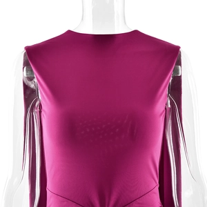 Detail of fuchsia sleeveless gown featuring high neckline and elegant pleated waist design