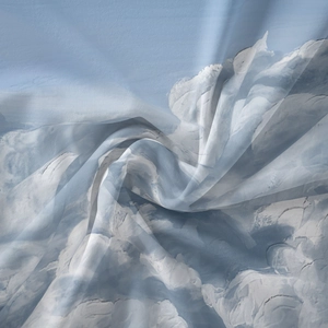 Detail of light blue cloud print mandala tapestry showing soft chiffon fabric texture