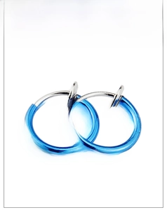 Macro detail of blue metallic punk spring clip-on earrings for non-pierced ears