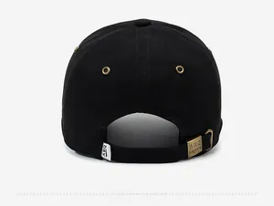 Detail of the black baseball cap back with adjustable strap and metal buckle