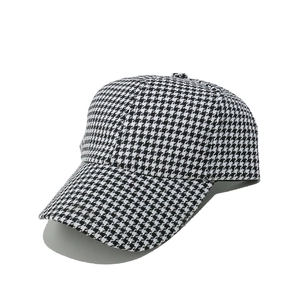 Detail of the houndstooth pattern fabric and six-panel structure on the baseball cap