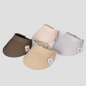 Top-down view of woven UV care sun visors in brown, khaki, beige, and off-white colors