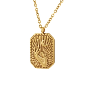Gold stainless steel necklace featuring rectangular moon and hand relief pendant