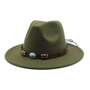 Detail of dark green fedora hat featuring brown leather band with turquoise stone accents
