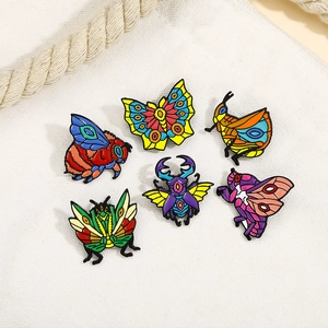 Detailed set of six colorful enamel insect pins featuring bee, moth, and beetle designs