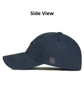 Side view detail of navy blue cotton baseball cap with intricate letter embroidery