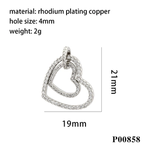 Detail view of a hollow heart pendant with zircons showing dimensions of 21mm by 19mm
