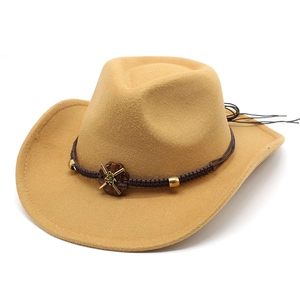Detail of khaki cowboy hat felt texture with braided band and sunflower ornament