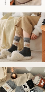 Detail of vintage Fair Isle wool socks with festive embroidery and knitted patterns