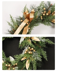 Detail of Christmas wreath with golden bows, golden berries and frosted pine needles
