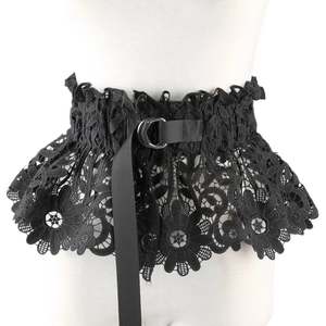 Detail of black lace corset belt with hollow floral pattern and double D-ring metal buckle