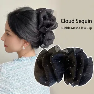 Elegant black puff mesh hair claw clip with sequins for a stylish bun hairstyle