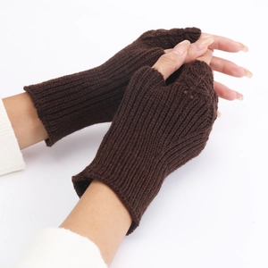 Close-up of coffee brown knit fingerless gloves showing detailed fish scale texture