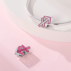 Detailed Sagittarius charm in pink enamel and cubic zirconia on a silver snake chain