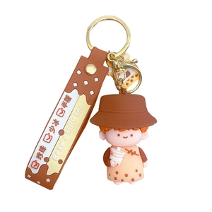 Cute brown cartoon milk tea girl keychain with printed strap and golden metal clasp