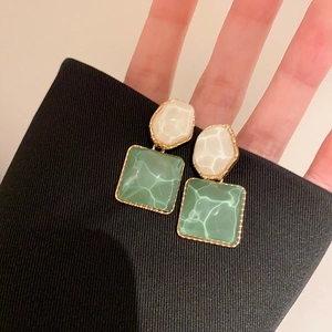 Golden irregular earrings with mint green square water ripple and cream oval detail