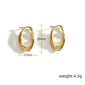 Detail view of gold multi-layer U-shaped earrings with 29mm height and 27mm width