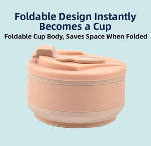 Flat view of a peach pink foldable silicone travel cup in its compact collapsed state