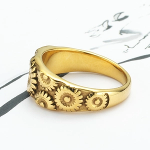 Golden titanium steel sunflower relief ring with intricate floral pattern engraving